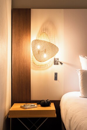 Luxe beddengoed, een minibar, een kluis op de kamer, een bureau