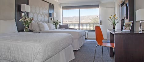 Desk, blackout drapes, iron/ironing board, bed sheets
