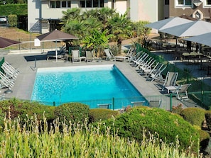 Seasonal outdoor pool, pool umbrellas, pool loungers