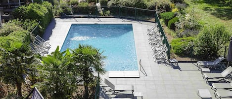 Seasonal outdoor pool, pool umbrellas, pool loungers