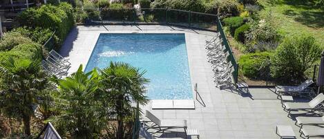 Seasonal outdoor pool, pool umbrellas, pool loungers