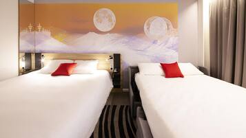 A hotel room with two beds, a large wall mural of a moonlit landscape, and a view of the mountains.