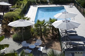 Seasonal outdoor pool, pool umbrellas, pool loungers