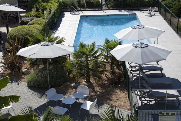 Seasonal outdoor pool, pool umbrellas, pool loungers