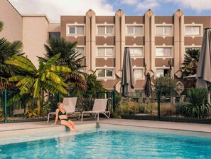 Seasonal outdoor pool, pool umbrellas, pool loungers