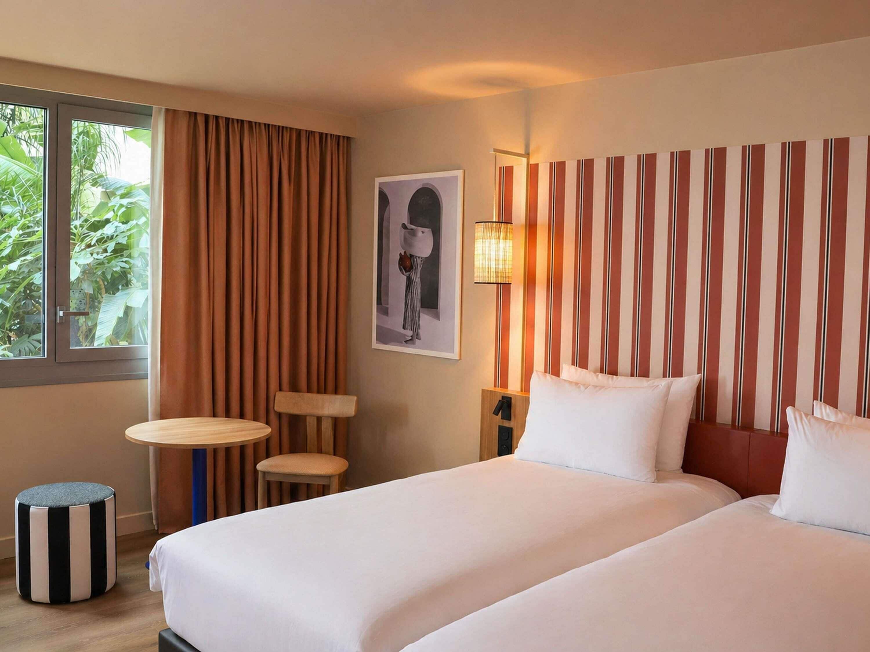 Classic Room with patio view - Twin beds | Premium bedding, in-room safe, desk, laptop workspace