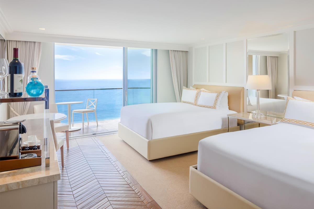 Premium bedding, down comforters, minibar, in-room safe