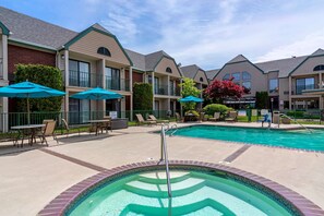 Seasonal outdoor pool, open 9:00 AM to 10:00 PM, pool umbrellas