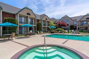 Seasonal outdoor pool, open 9:00 AM to 10:00 PM, pool umbrellas