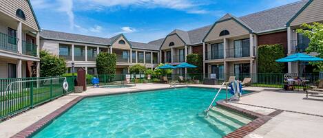 Seasonal outdoor pool, open 9:00 AM to 10:00 PM, pool umbrellas