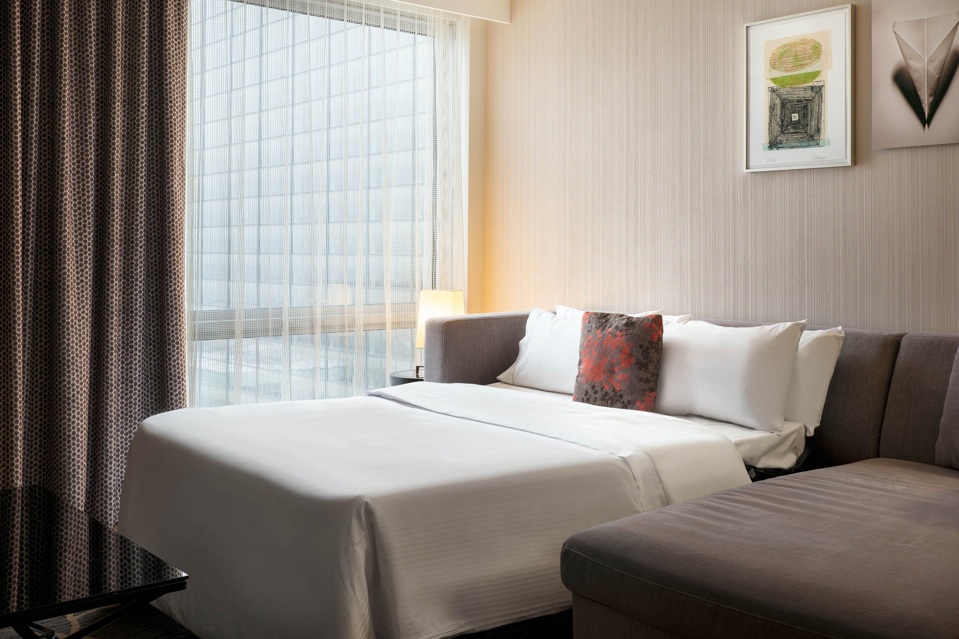 Down comforters, pillowtop beds, in-room safe, desk