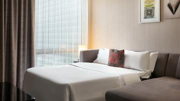 Down comforters, pillowtop beds, in-room safe, desk