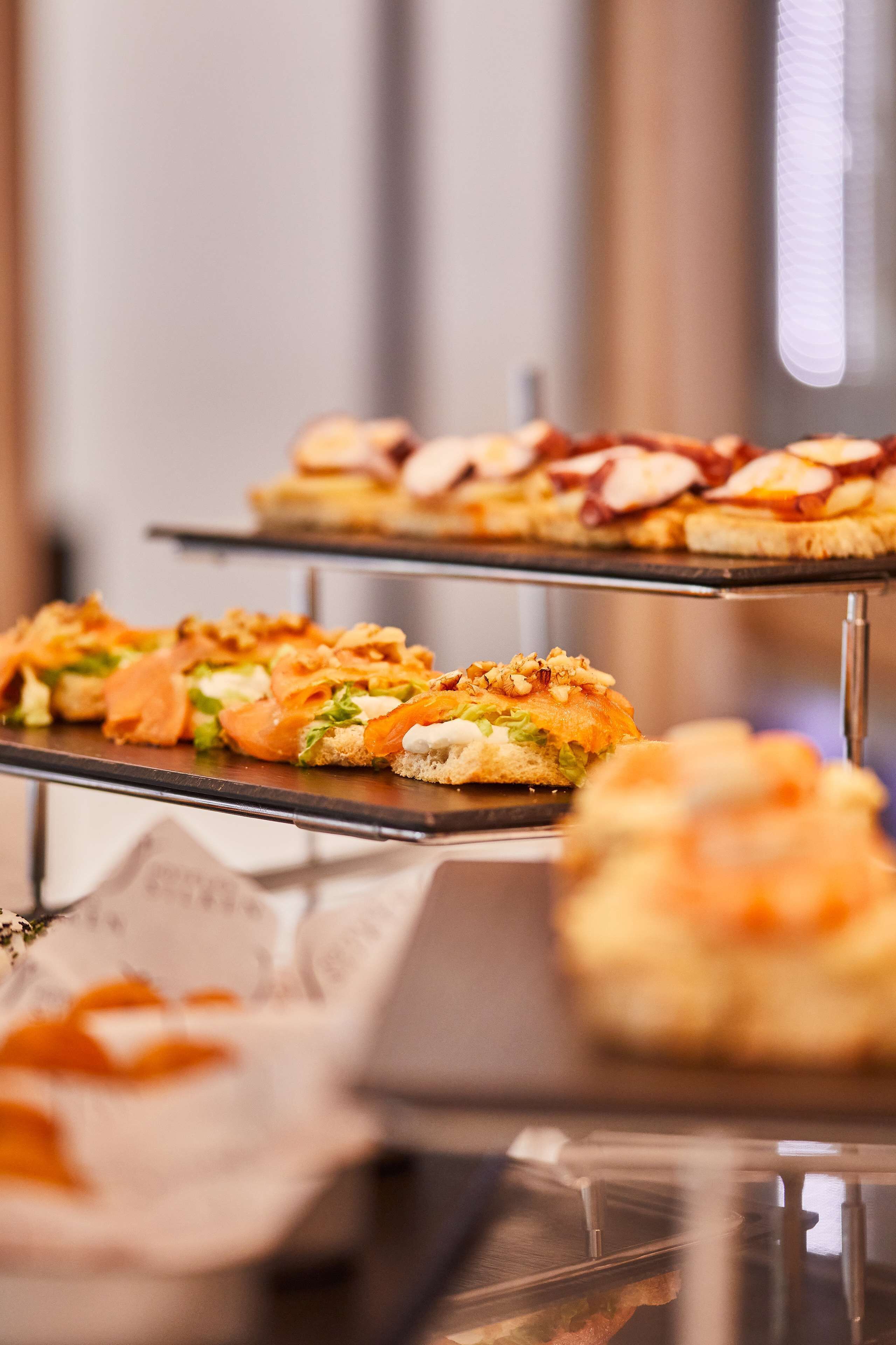 A buffet with various food items on display.