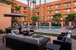 Outdoor pool, open 6:00 AM to 10:00 PM, sun loungers