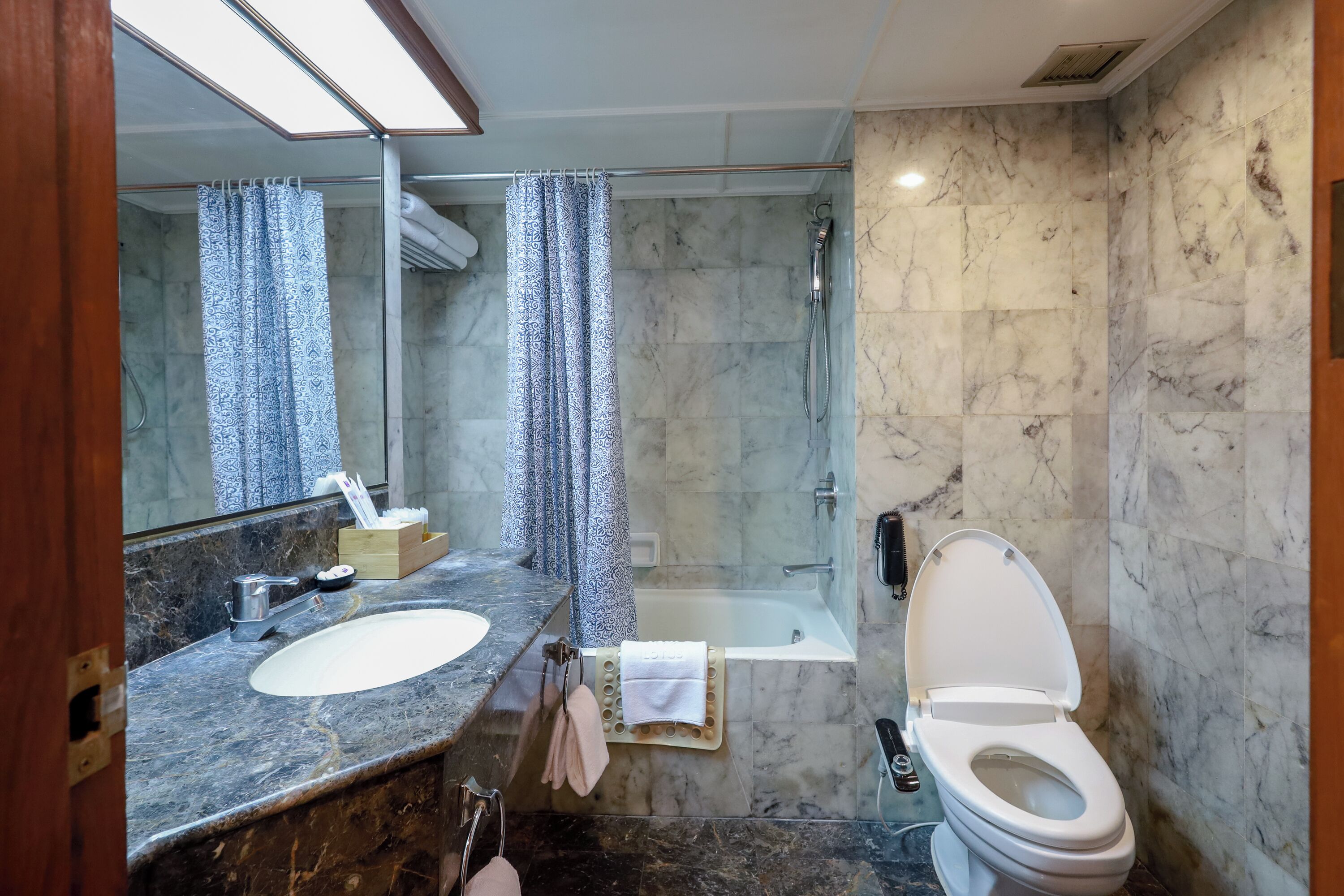 family room, multiple beds | bathroom | combined shower/bathtub, eco-friendly toiletries, hair dryer, bathrobes