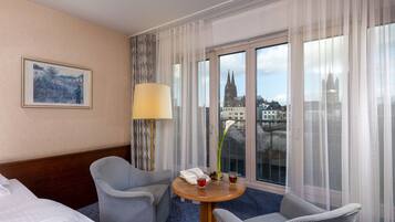 Classic Double Room | Living area | Flat-screen TV, pay films