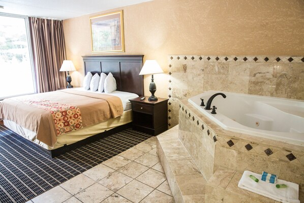 Deluxe Suite, 1 King Bed, Jetted Tub | Desk, blackout drapes, iron/ironing board, free WiFi