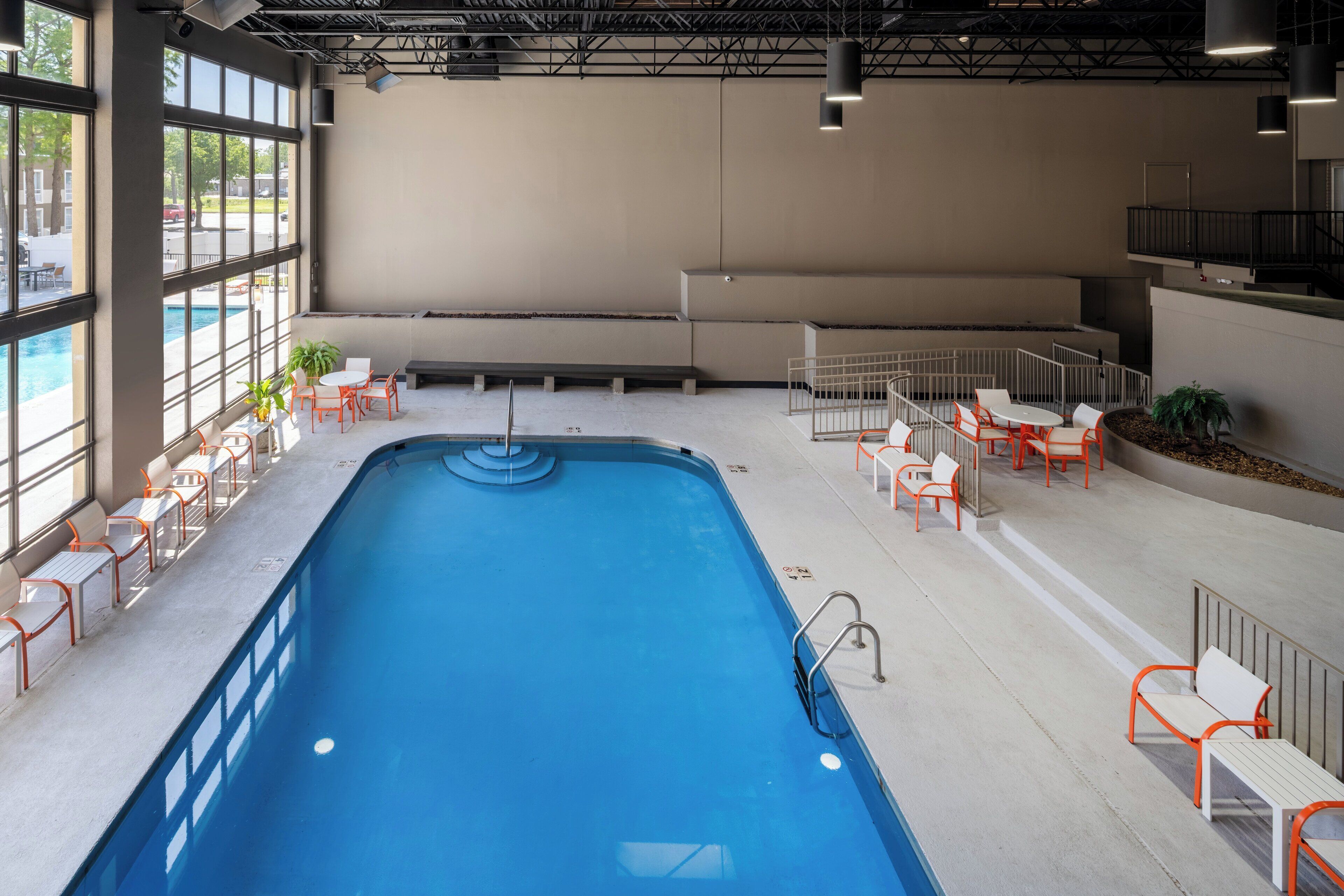 indoor pool, seasonal outdoor pool, open 7 am to 10 pm, pool umbrellas