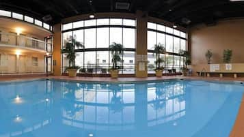 Indoor pool, seasonal outdoor pool, open 7 AM to 10 PM, pool umbrellas