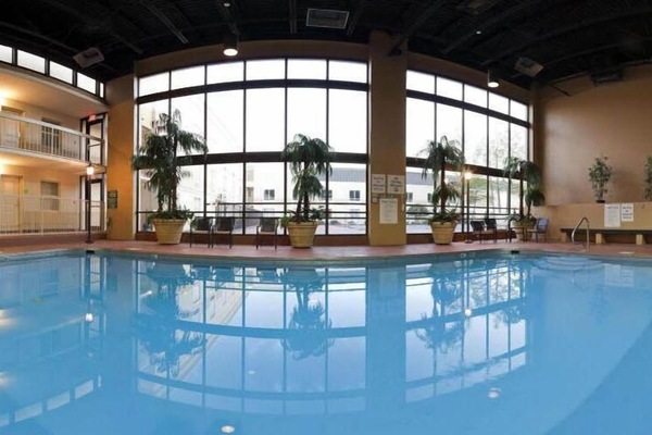 Indoor pool, seasonal outdoor pool, open 7 AM to 10 PM, pool umbrellas