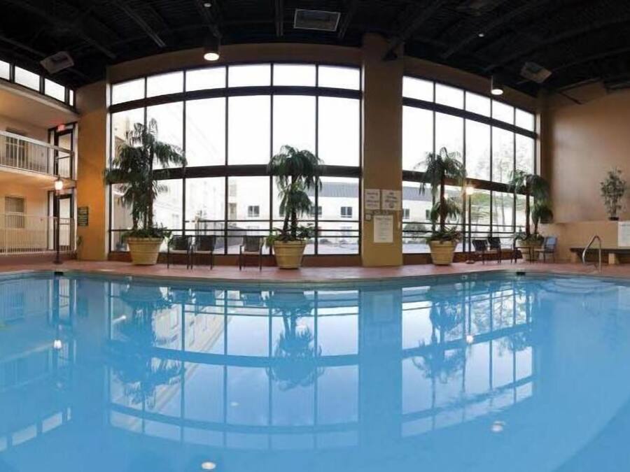 Indoor pool, seasonal outdoor pool, open 7 AM to 10 PM, pool umbrellas
