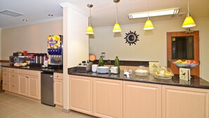 A kitchen with a built-in dishwasher, a coffee station, and a fruit bowl. - Best Western Tumwater-Olympia Inn (Olympia)
