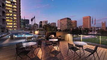 Outdoor pool, open 6:00 AM to 10 PM, pool loungers