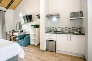 Room, 1 King Bed, Garden View | 1 bedroom, minibar, in-room safe, desk