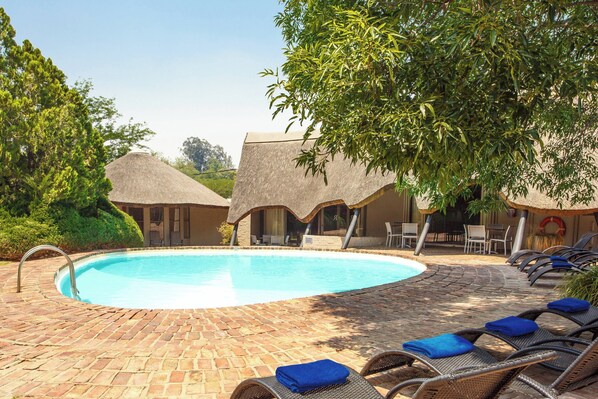 Outdoor pool, pool umbrellas, sun loungers