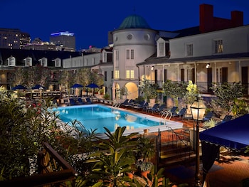 Outdoor pool, open 11:00 AM to 7:00 PM, pool umbrellas, sun loungers at The Royal Sonesta New Orleans