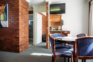 Premium bedding, pillow-top beds, desk, laptop workspace