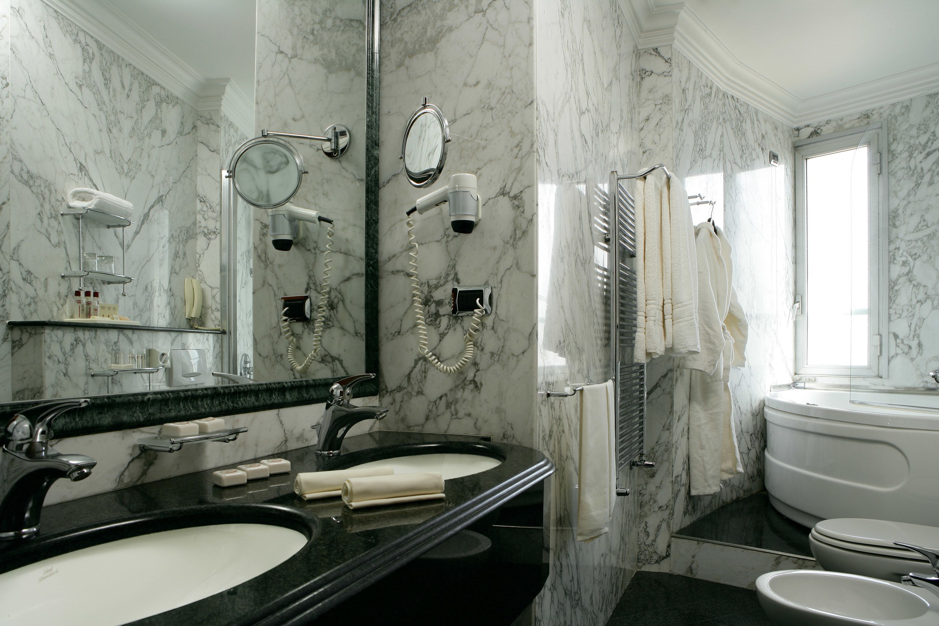 free toiletries, hair dryer, bidet, towels