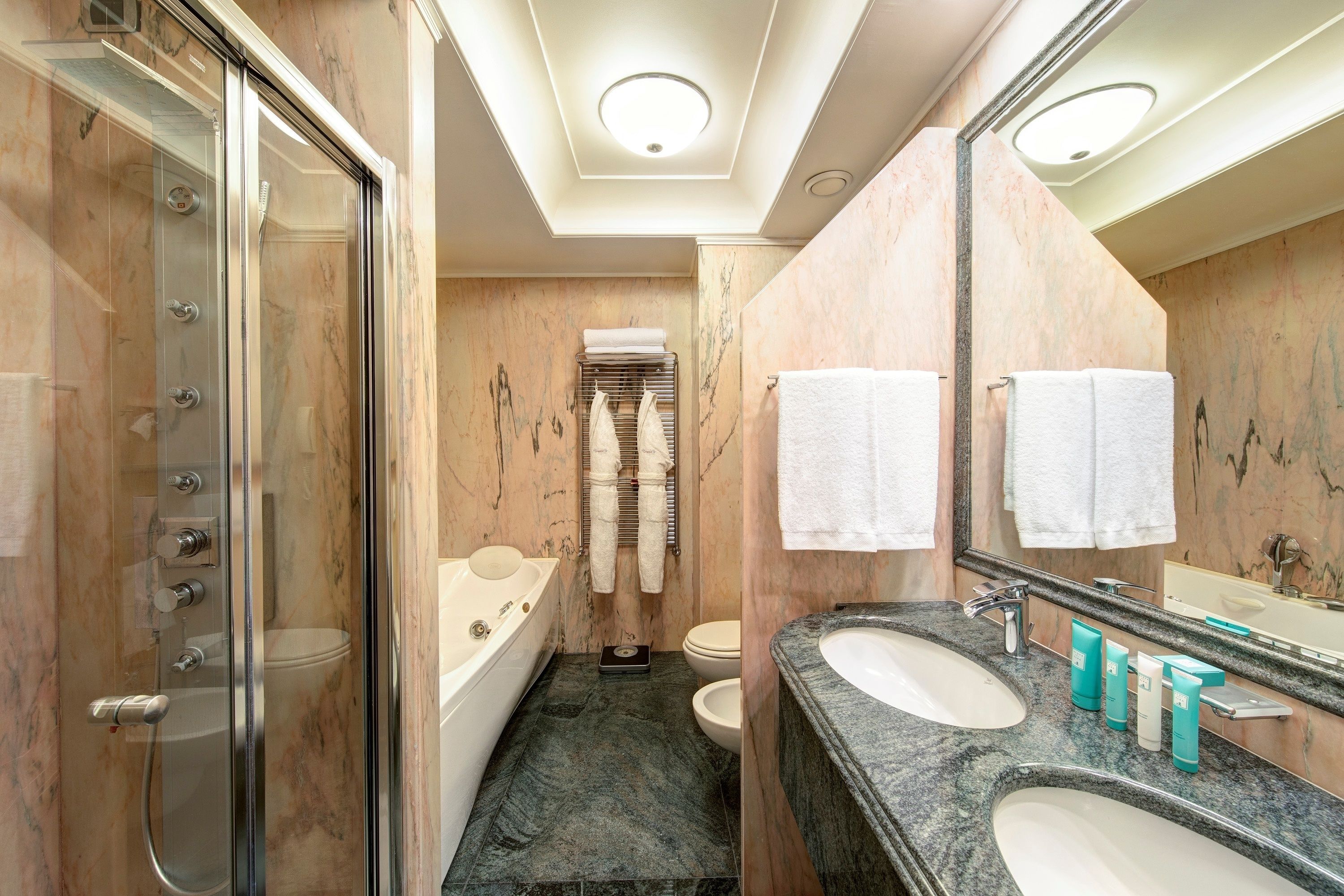 free toiletries, hair dryer, bidet, towels