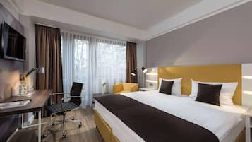 Ropa de cama hipoalergénica y tabla de planchar con plancha