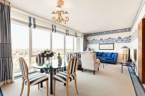 Neptune One Bedroom Suite | Living area | 49-inch flat-screen TV with cable channels, Smart TV