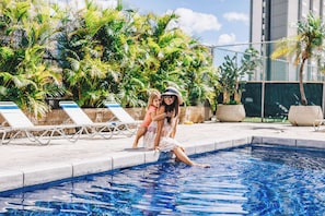 Outdoor pool, open 9:00 AM to 9:00 PM, pool loungers