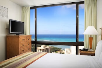 Suite, 1 Bedroom, Ocean View | In-room safe, desk, blackout drapes, iron/ironing board at Aston Waikiki Sunset