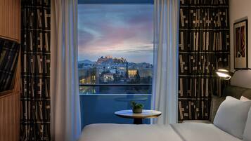 Premium bedding, down comforters, minibar, in-room safe