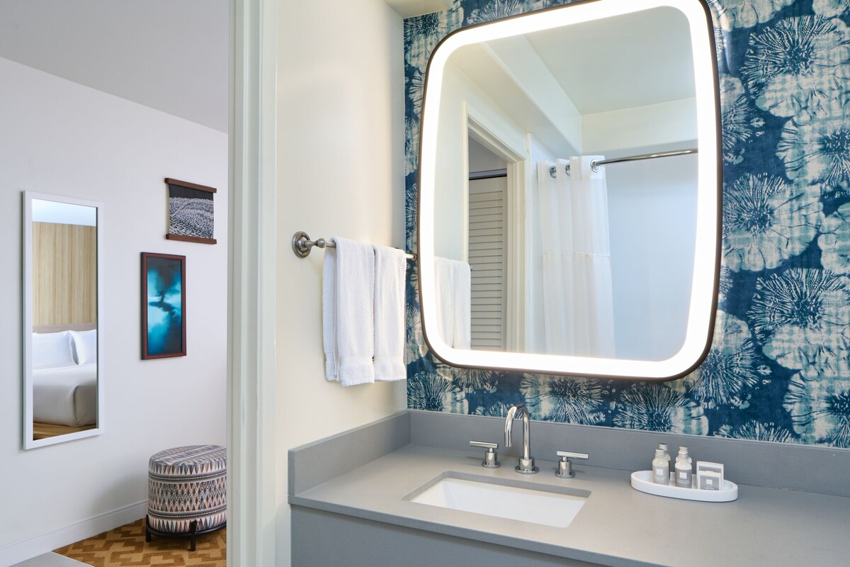 Designer toiletries, hair dryer, towels