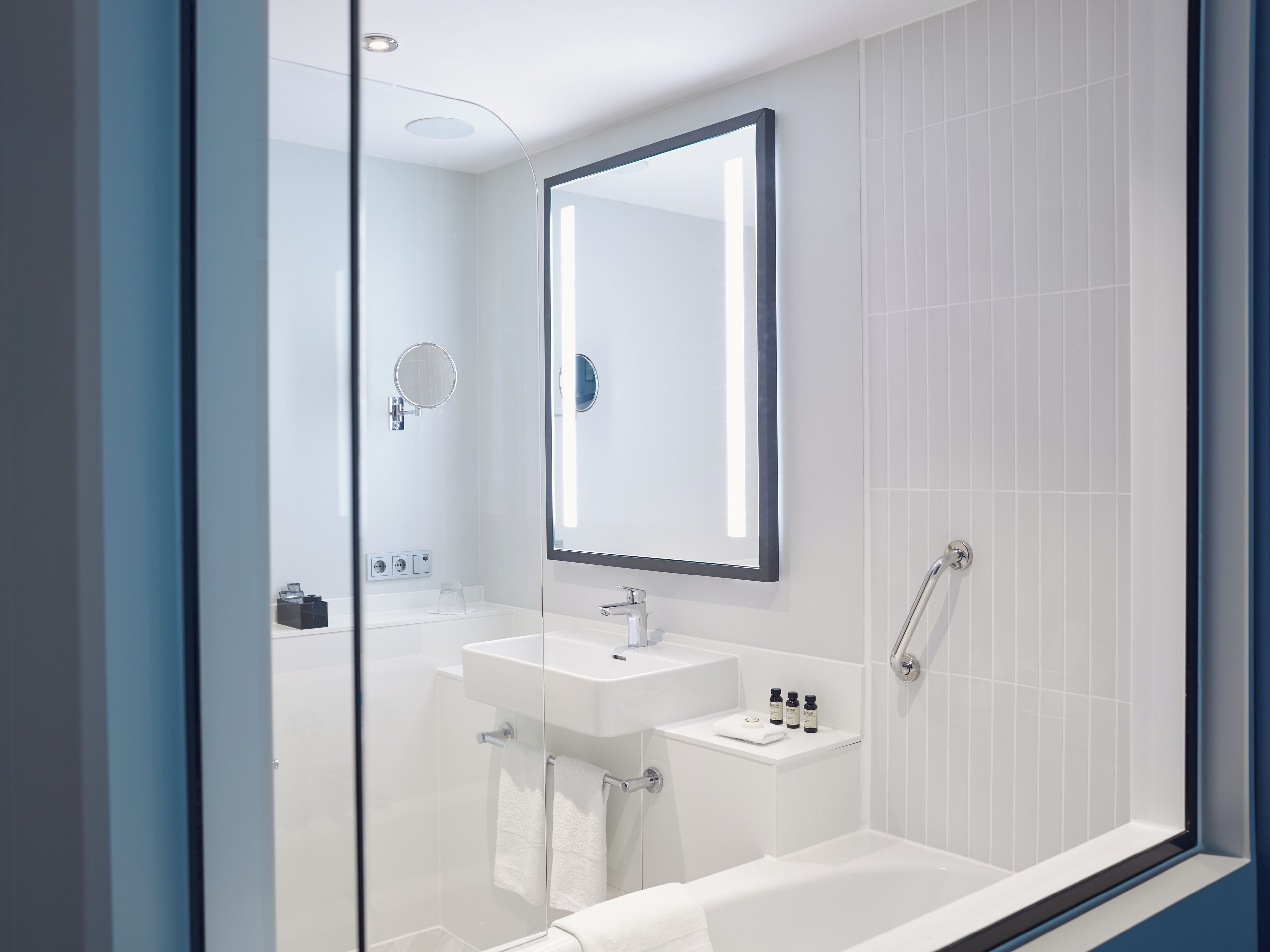 designer toiletries, hair dryer, bathrobes, slippers