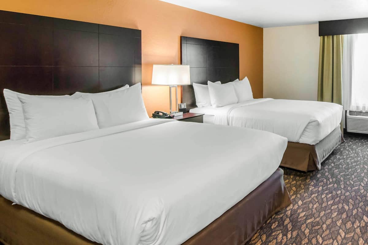 Premium bedding, desk, laptop workspace, blackout curtains