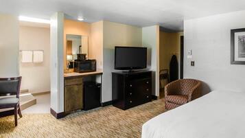 Premium bedding, desk, laptop workspace, blackout drapes