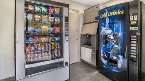 A vending machine with snacks and a separate cold drink machine. - Red Roof Inn Greenville (Greenville)