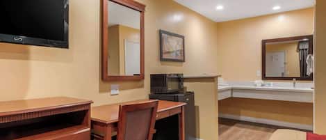 Hypo-allergenic bedding, desk, laptop workspace, blackout drapes