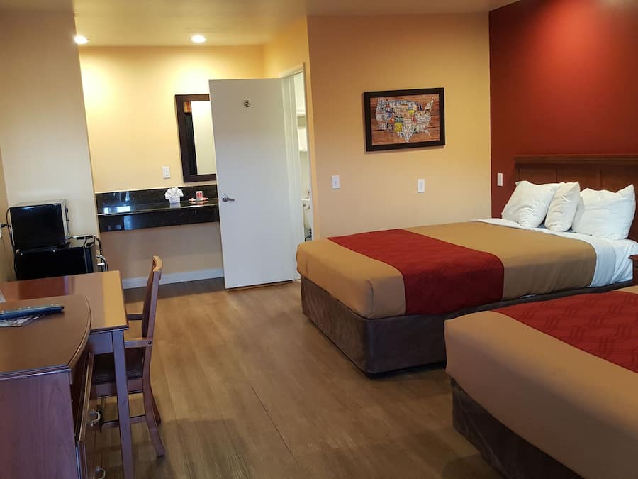 Hypo-allergenic bedding, desk, laptop workspace, blackout curtains