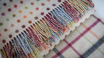 A fabric with a polka dot pattern and a fringe.