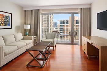 Luxury 1 Bedroom Suite Ocean View | Living area | 40-inch LCD TV with cable channels, TV, DVD player at Ilikai Hotel & Luxury Suites