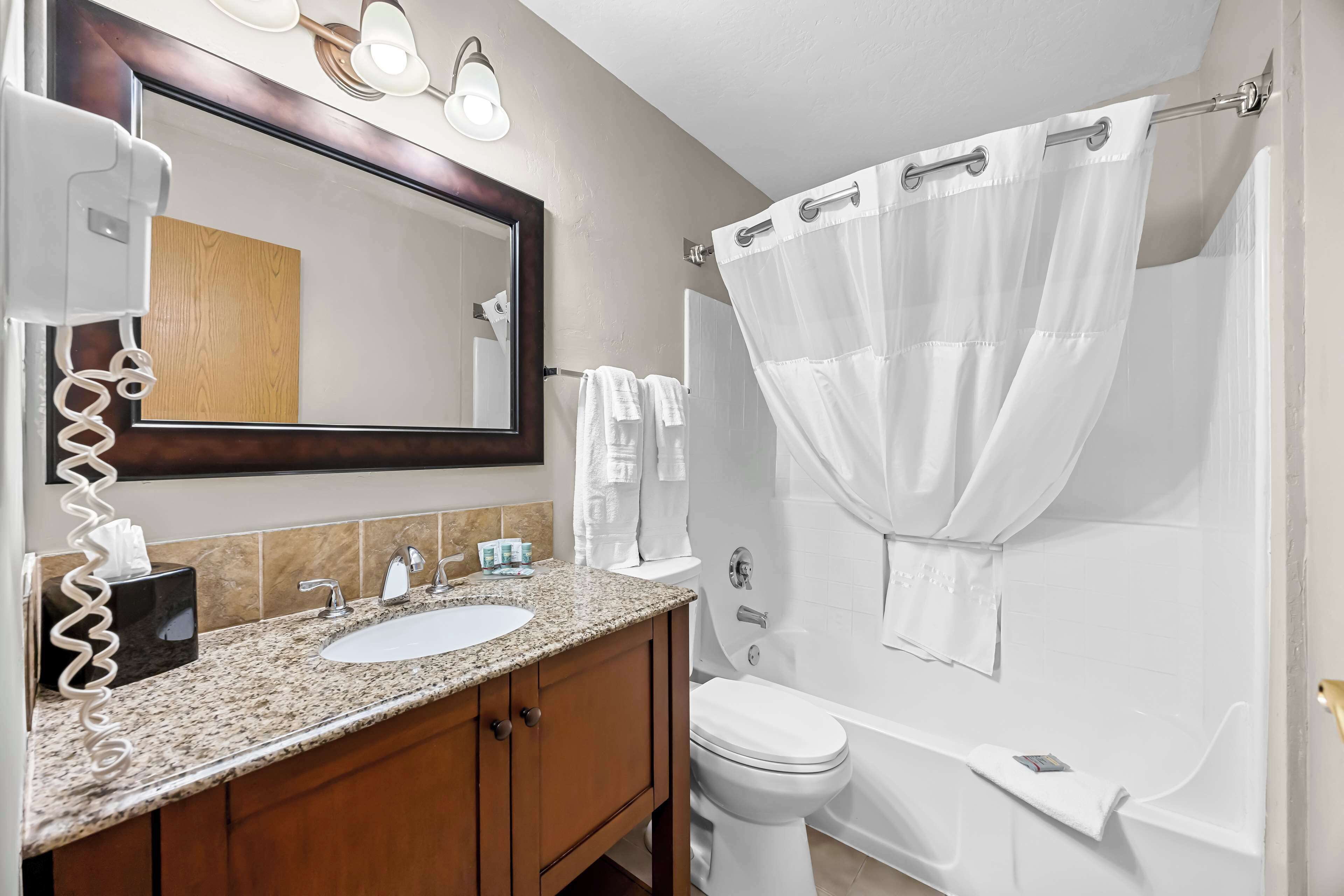 suite, 1 king bed, non smoking, refrigerator & microwave (with sofabed) | bathroom | free toiletries, hair dryer, towels