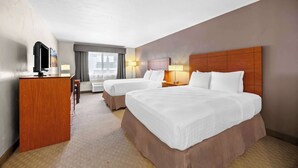 A hotel room with two beds, a desk, a TV, and a window with curtains. - Best Western Inn At The Rogue (Grants Pass)