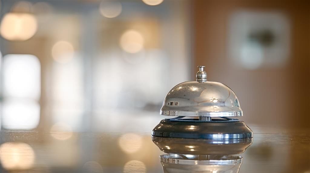 A metallic object with a reflective surface, possibly a part of a room's decor or furniture.
